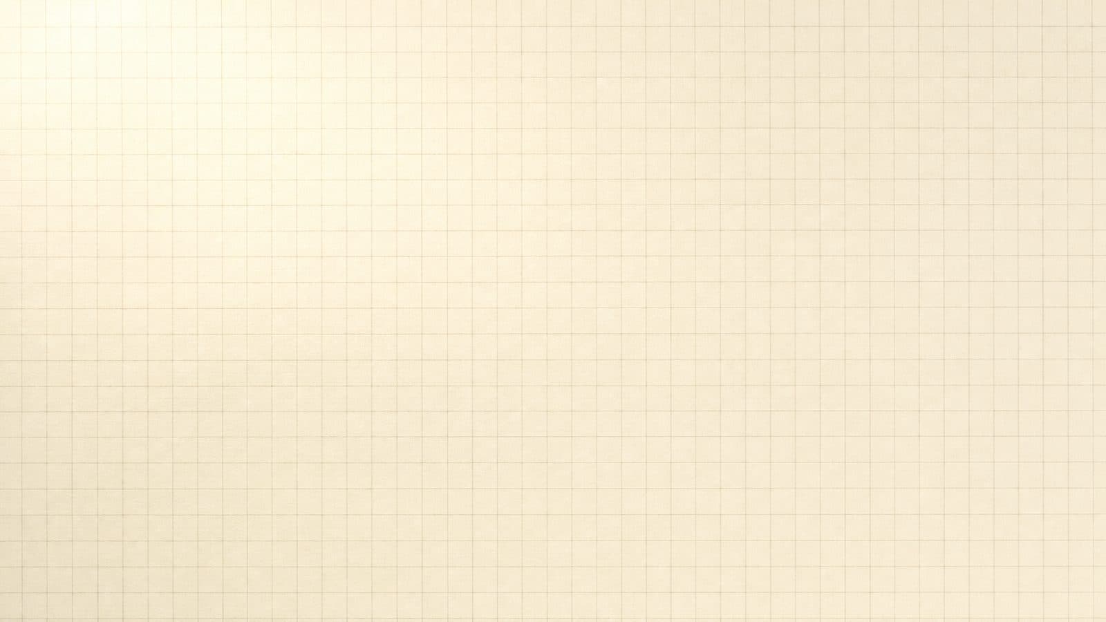 A sheet of fine cream graph paper lit from the top left.